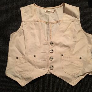 Cream vest.